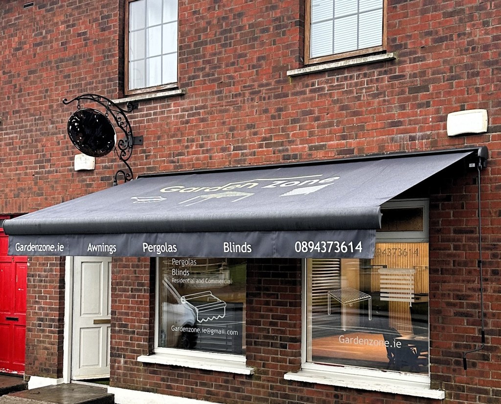 GardenZone commercial awning on a brick shopfront