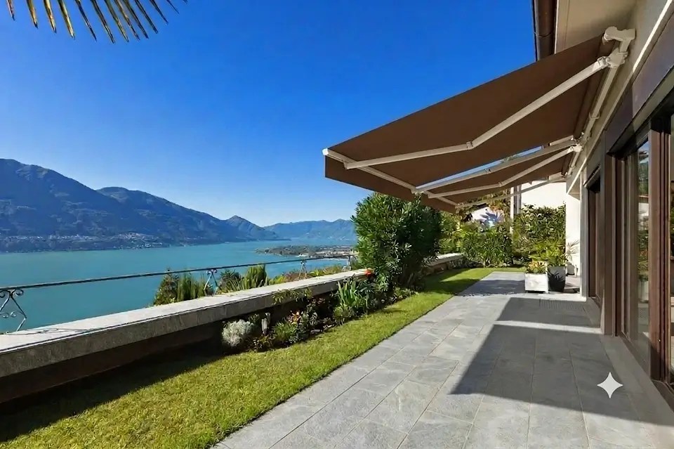 Awnings shading a long terrace with lake views