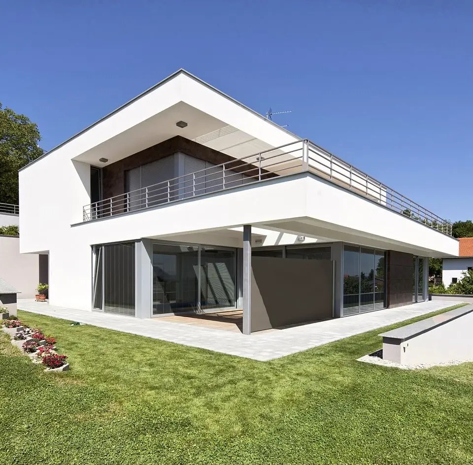 Modern house with an awning shading large glazed doors