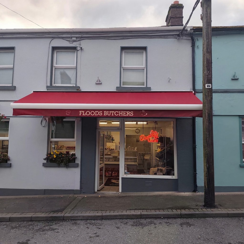 Red commercial awning over a shopfront