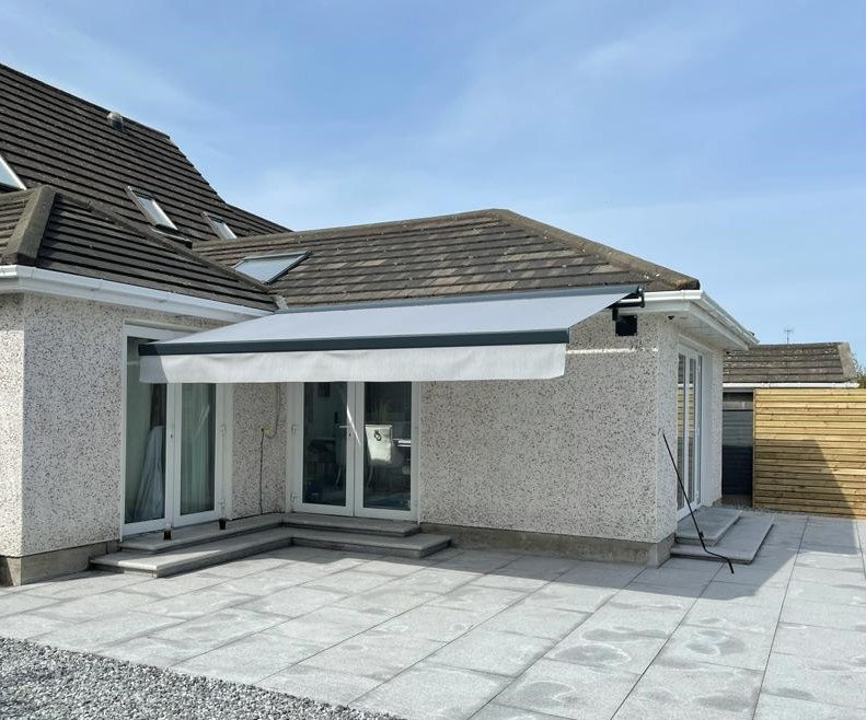 Retractable awning on a bungalow patio in Ireland