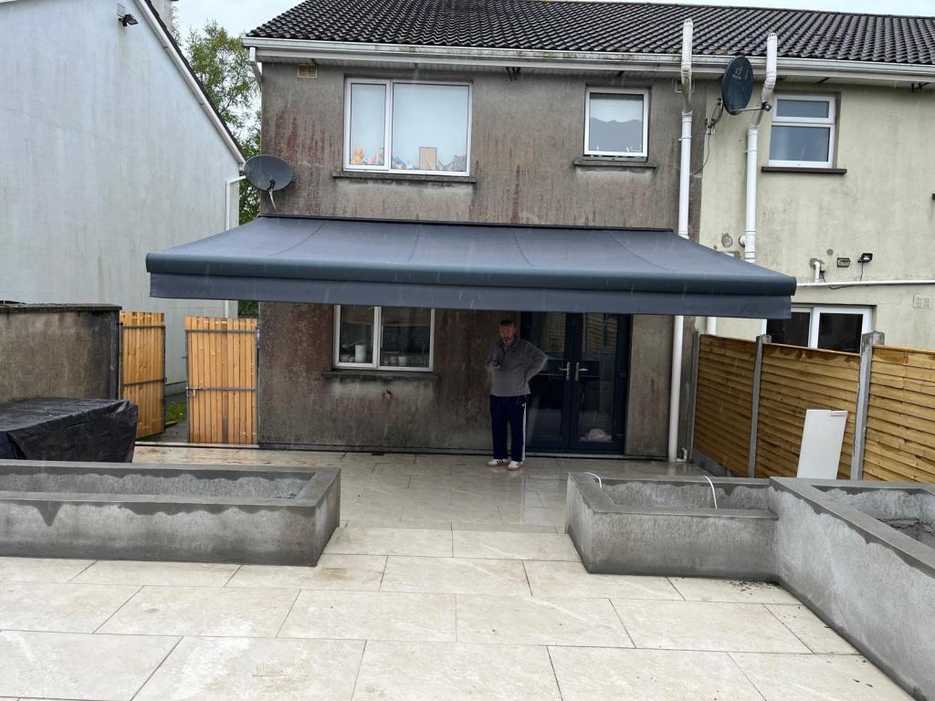 Retractable awning shading a rear patio