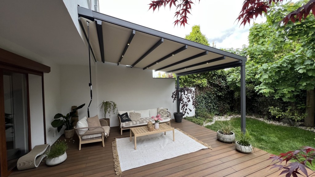 Retractable pergola creating an outdoor living space