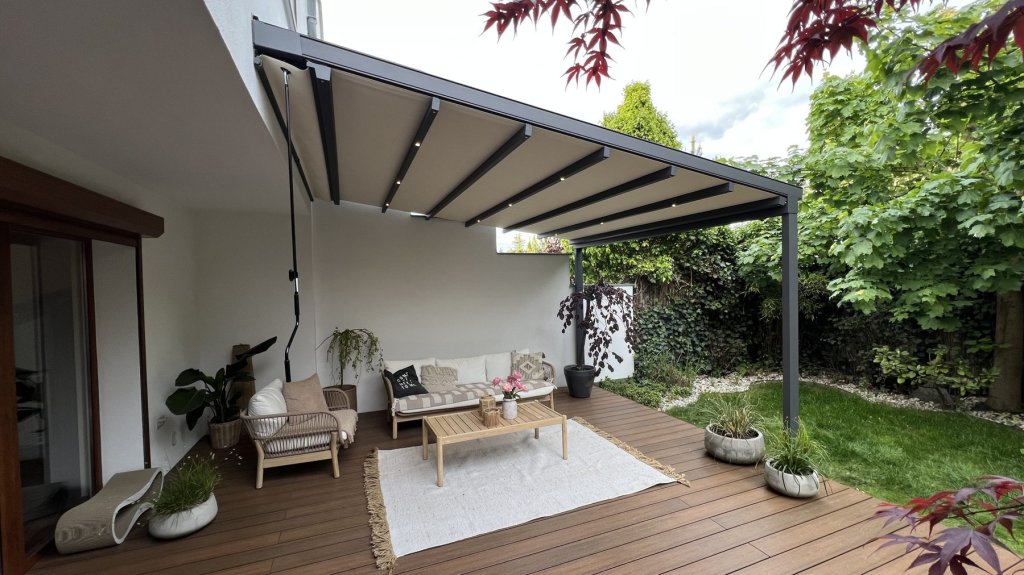 Retractable pergola above a garden lounge area