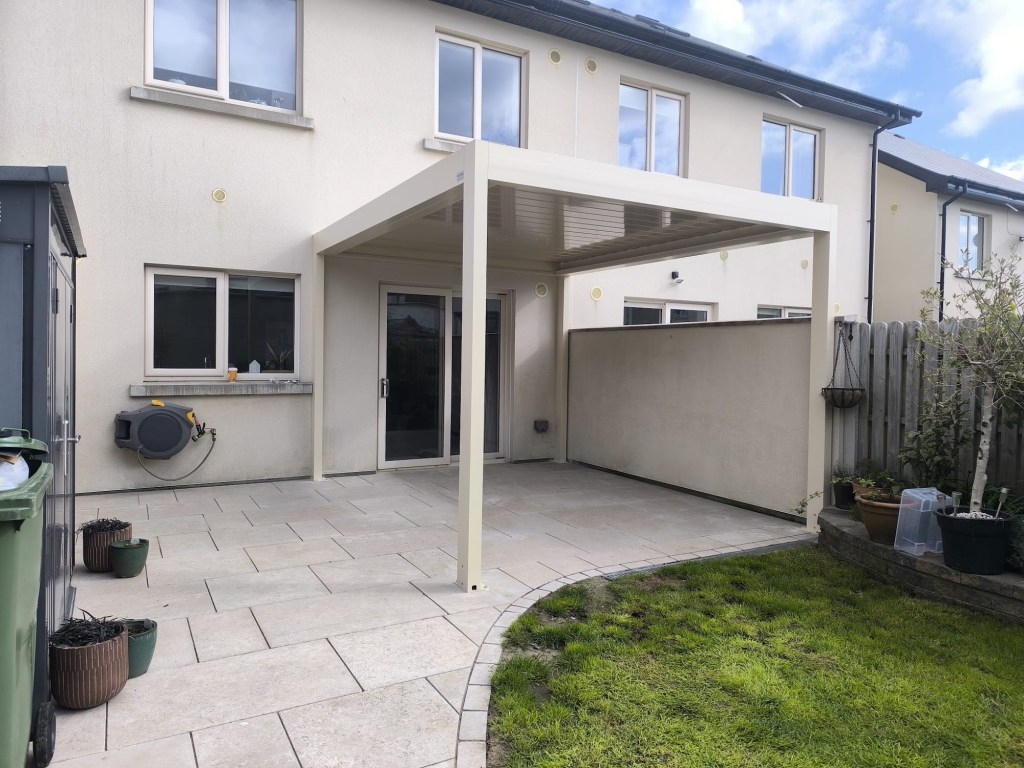 White bioclimatic louvred pergola on a patio